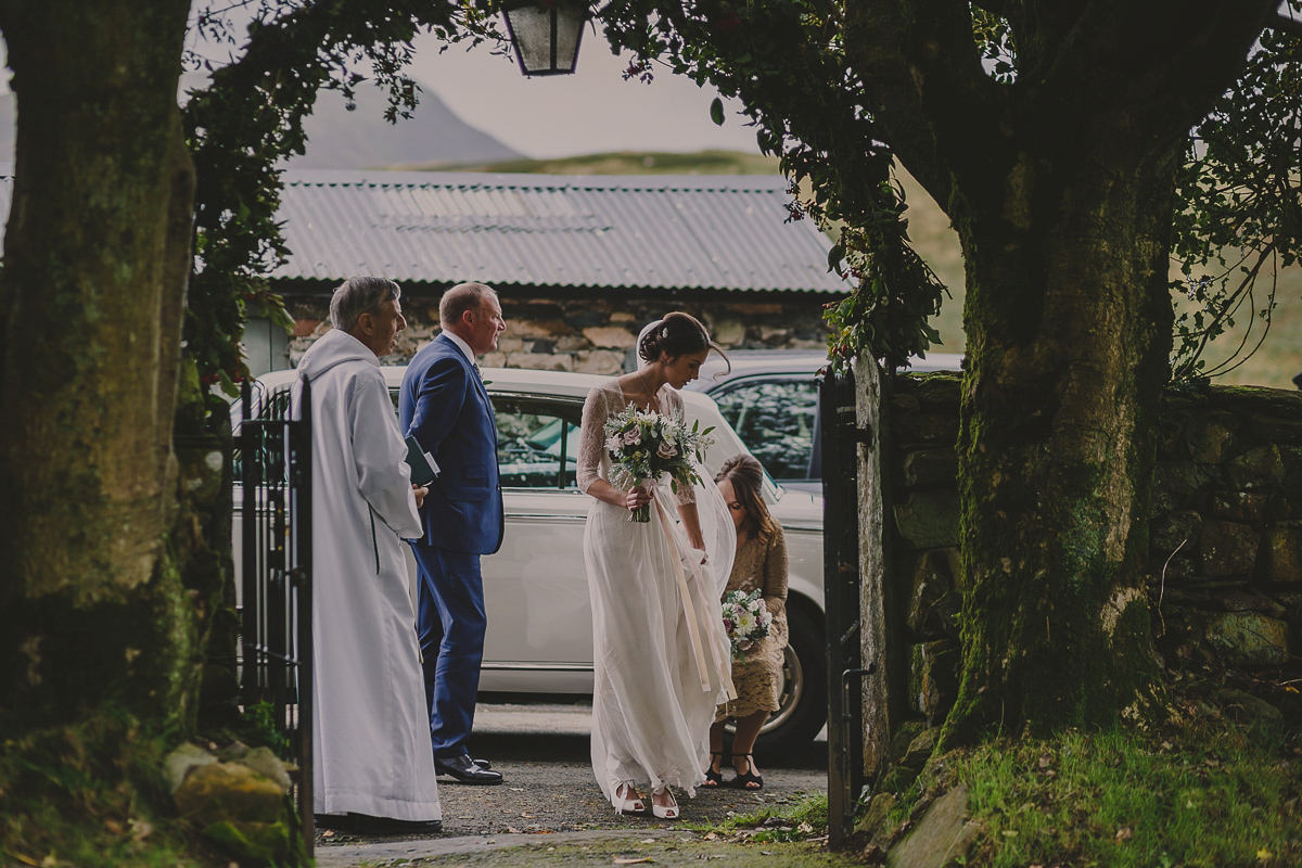 Bride Lucy wore the 'Peony' gown by Naomi Neoh for her romantic and elegant gin inspired wedding in the Lake District. Photography by Lottie Elizabeth.