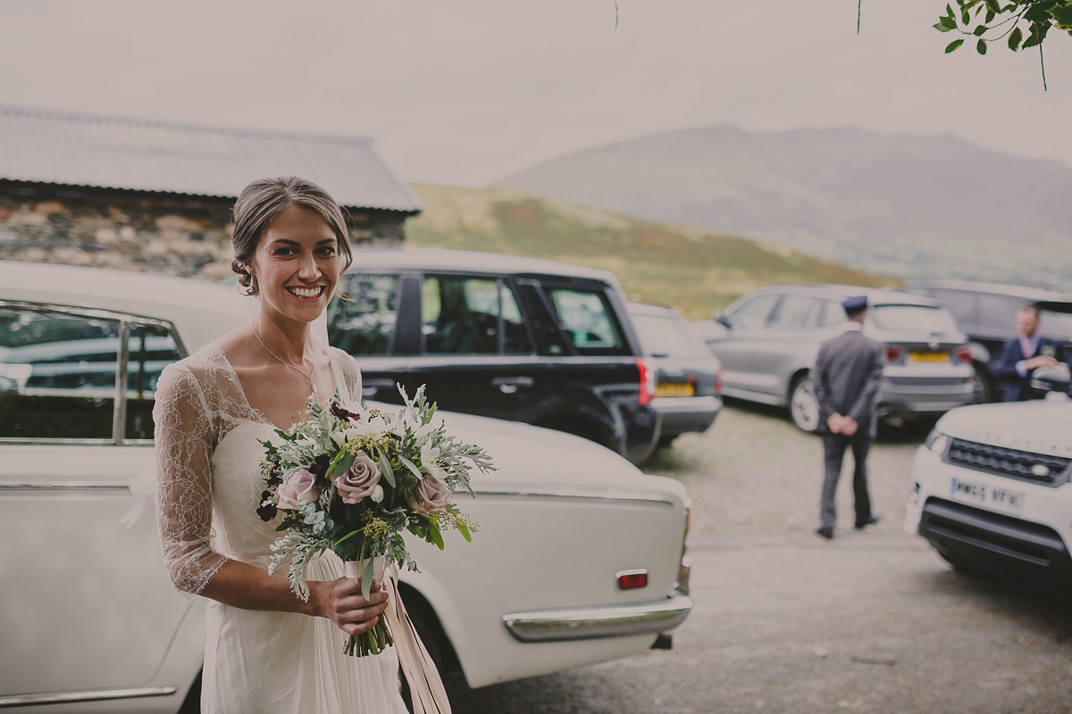 Bride Lucy wore the 'Peony' gown by Naomi Neoh for her romantic and elegant gin inspired wedding in the Lake District. Photography by Lottie Elizabeth.