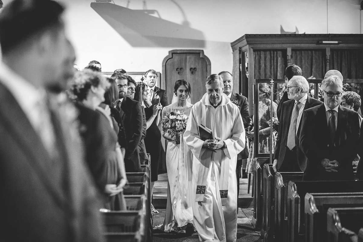 Bride Lucy wore the 'Peony' gown by Naomi Neoh for her romantic and elegant gin inspired wedding in the Lake District. Photography by Lottie Elizabeth.