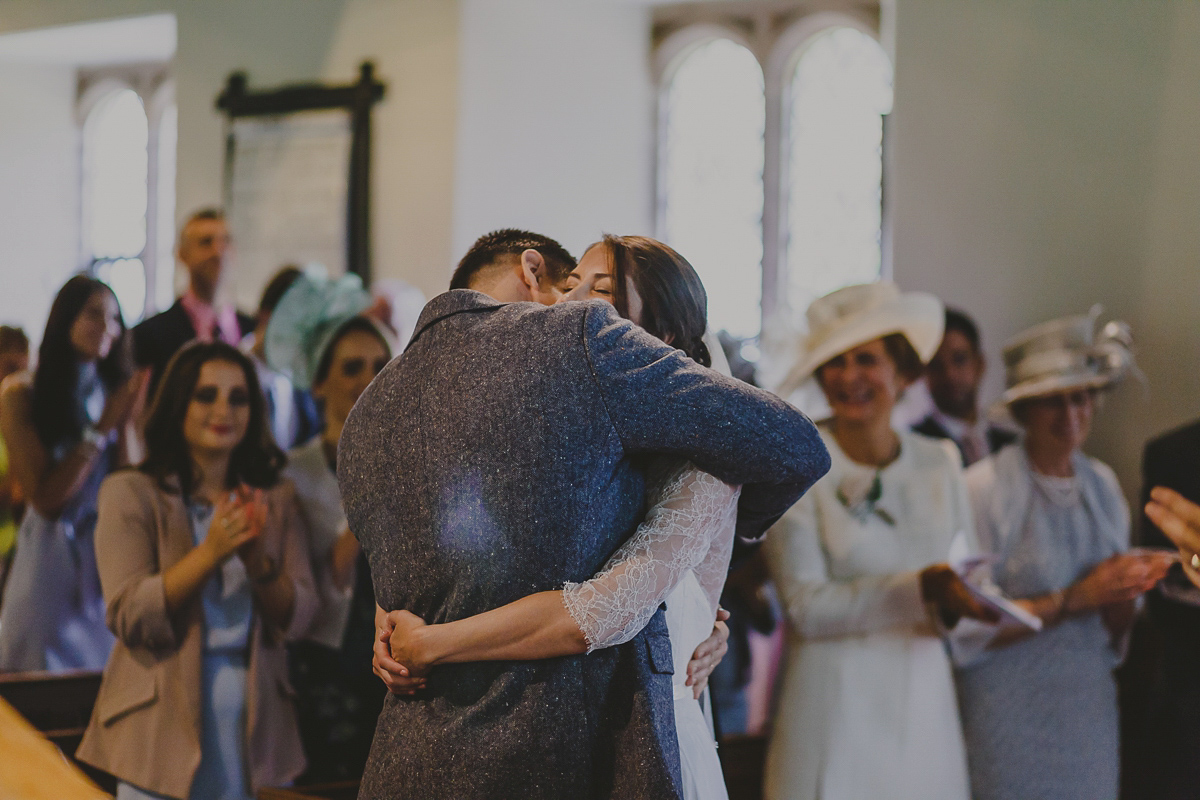 Bride Lucy wore the 'Peony' gown by Naomi Neoh for her romantic and elegant gin inspired wedding in the Lake District. Photography by Lottie Elizabeth.