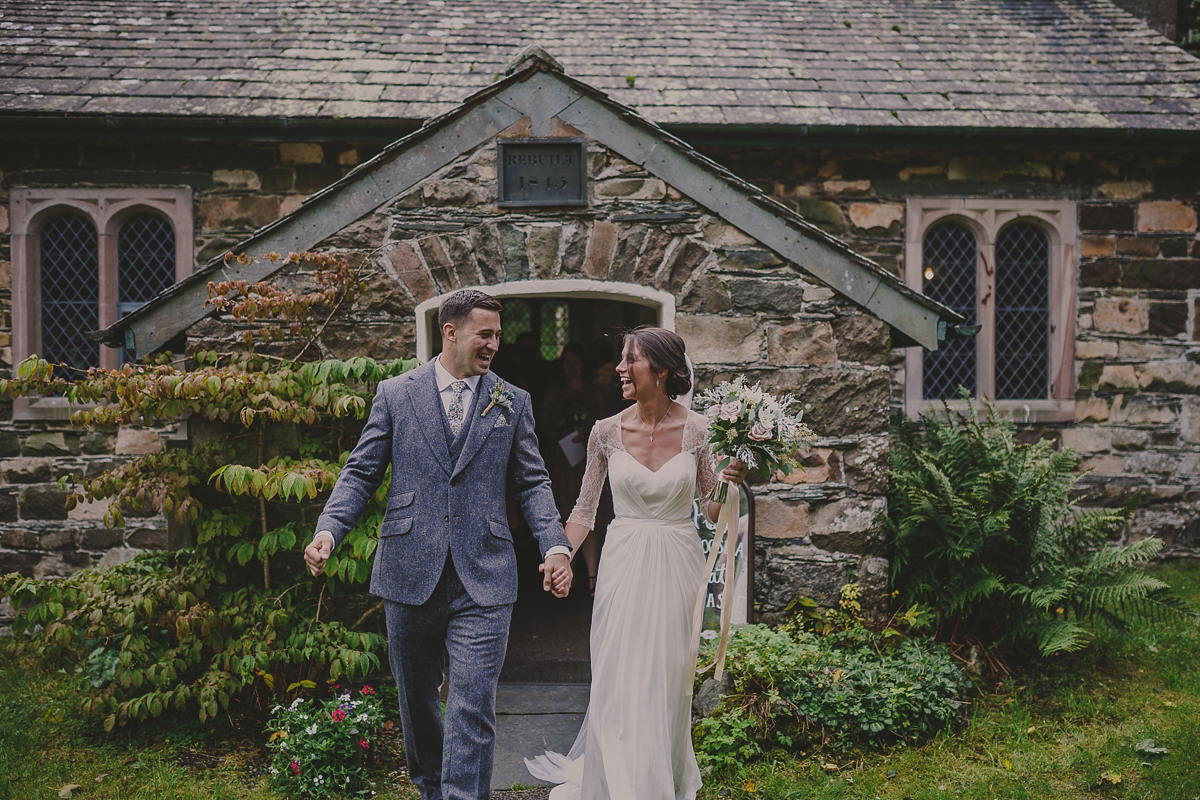 Bride Lucy wore the 'Peony' gown by Naomi Neoh for her romantic and elegant gin inspired wedding in the Lake District. Photography by Lottie Elizabeth.