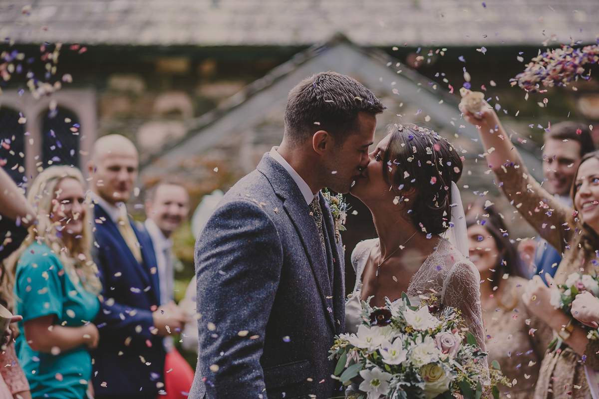 Bride Lucy wore the 'Peony' gown by Naomi Neoh for her romantic and elegant gin inspired wedding in the Lake District. Photography by Lottie Elizabeth.