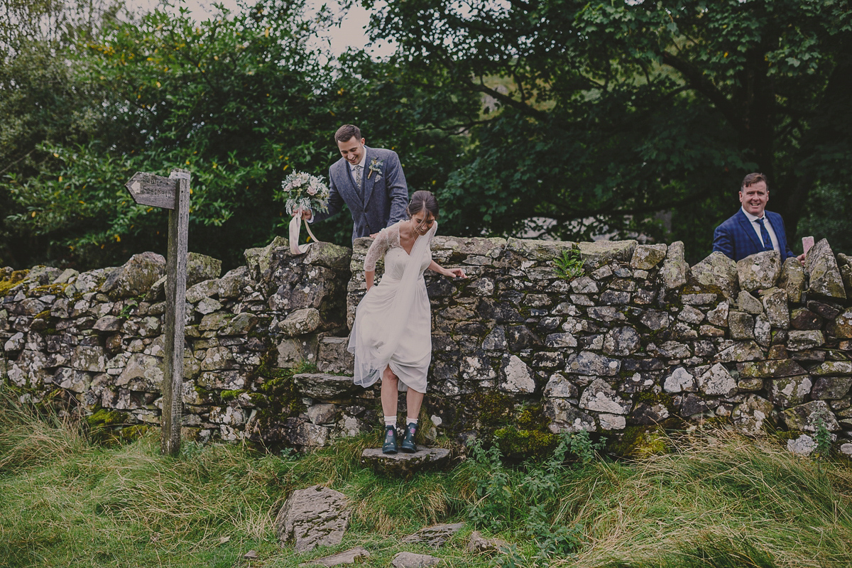 Bride Lucy wore the 'Peony' gown by Naomi Neoh for her romantic and elegant gin inspired wedding in the Lake District. Photography by Lottie Elizabeth.