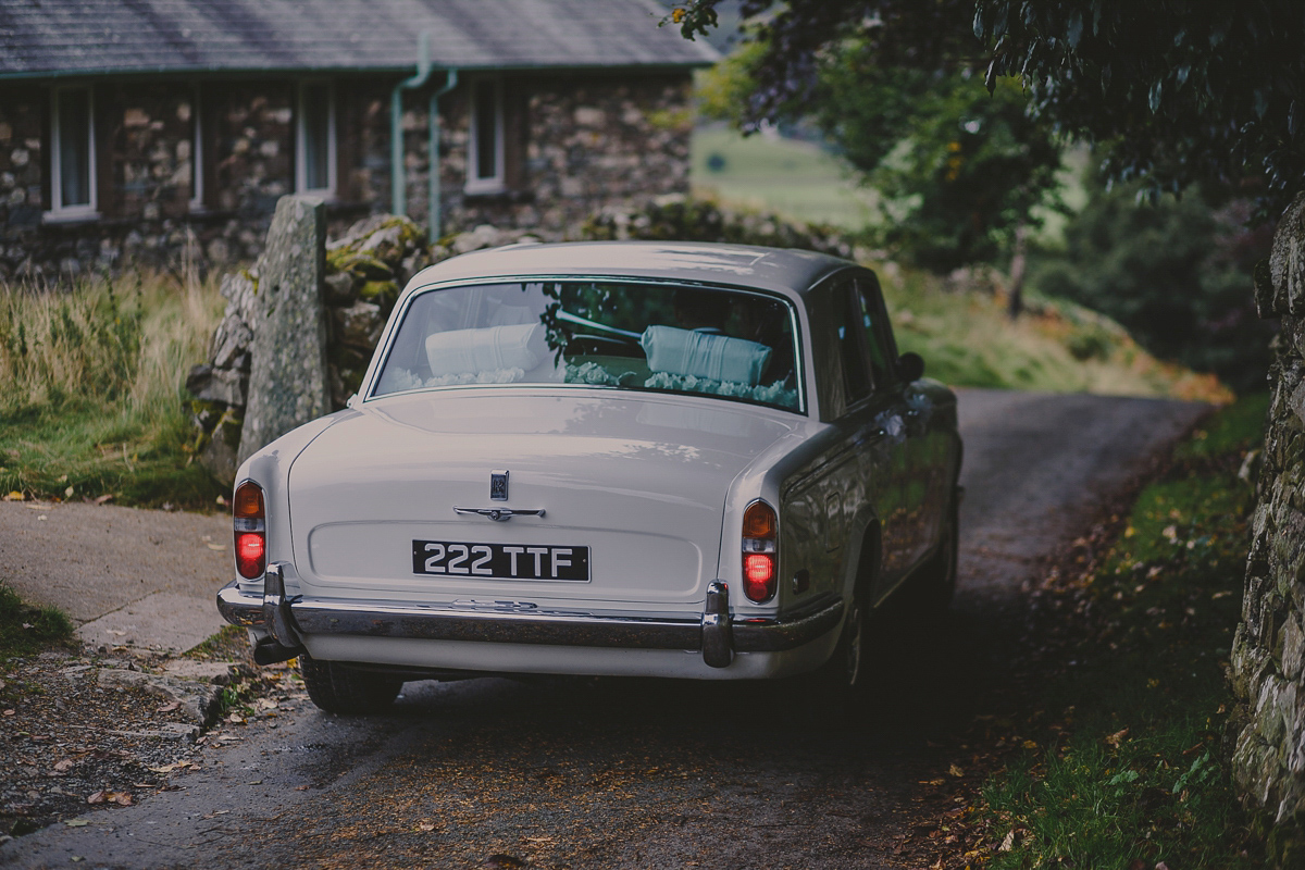 Bride Lucy wore the 'Peony' gown by Naomi Neoh for her romantic and elegant gin inspired wedding in the Lake District. Photography by Lottie Elizabeth.