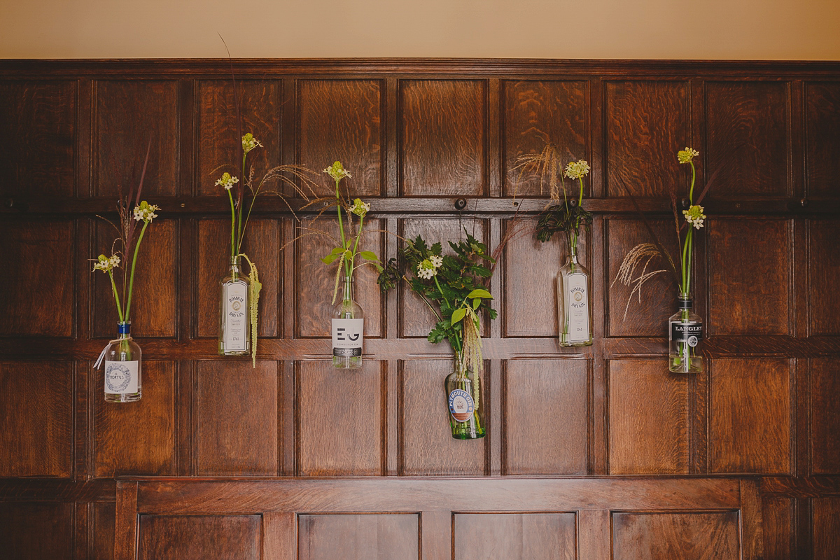 Bride Lucy wore the 'Peony' gown by Naomi Neoh for her romantic and elegant gin inspired wedding in the Lake District. Photography by Lottie Elizabeth.