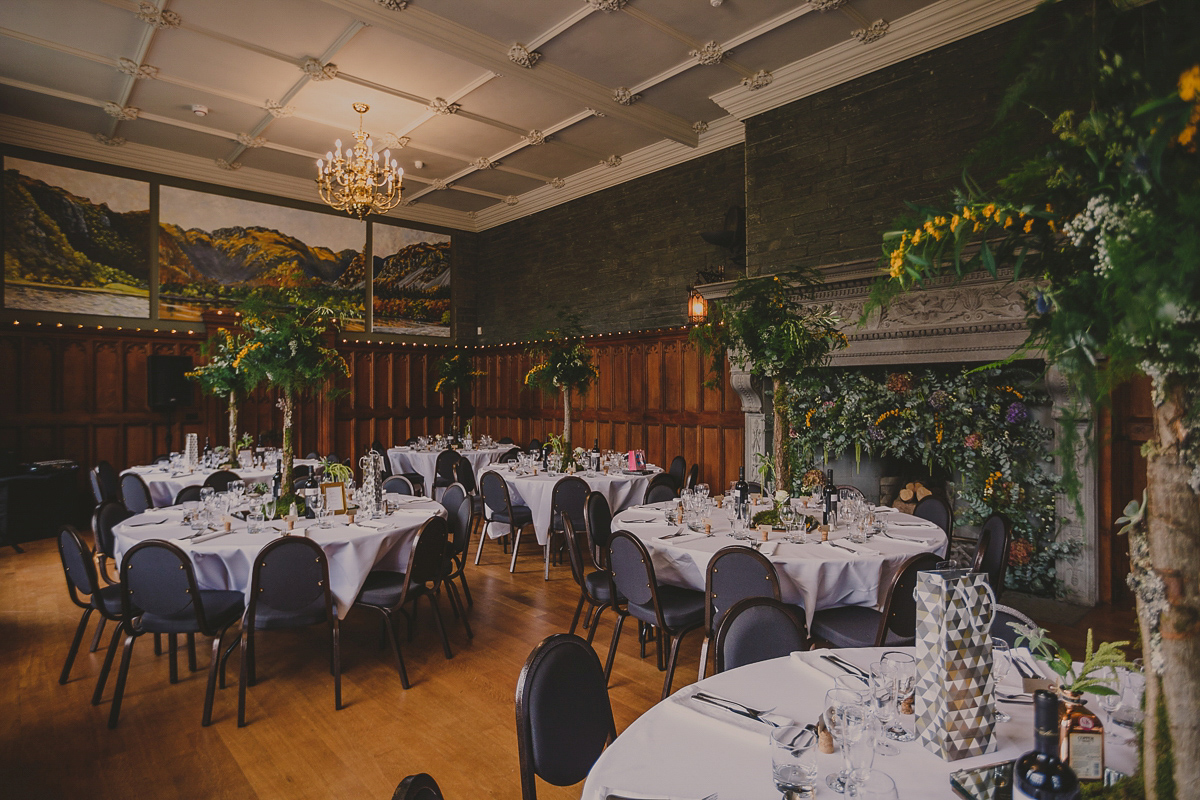 Bride Lucy wore the 'Peony' gown by Naomi Neoh for her romantic and elegant gin inspired wedding in the Lake District. Photography by Lottie Elizabeth.