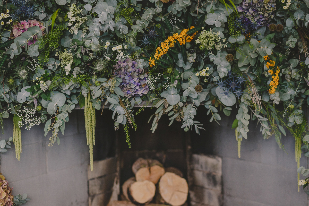 Bride Lucy wore the 'Peony' gown by Naomi Neoh for her romantic and elegant gin inspired wedding in the Lake District. Photography by Lottie Elizabeth.