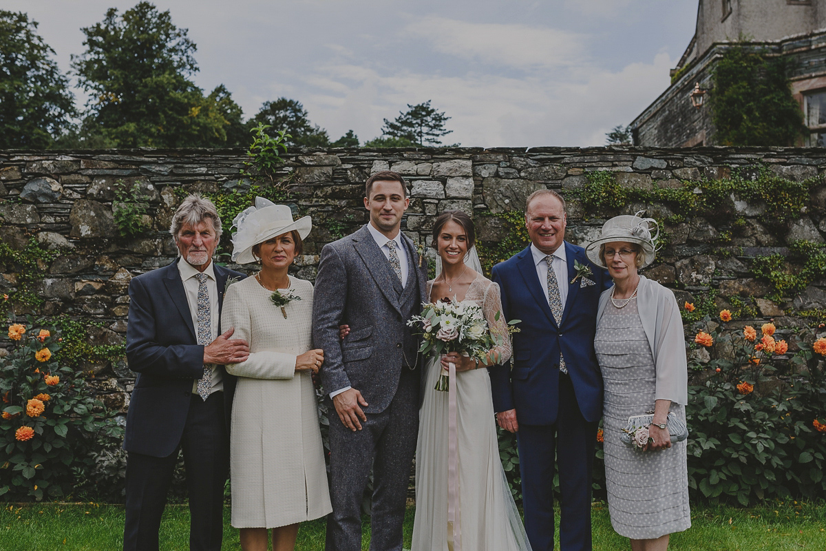 Bride Lucy wore the 'Peony' gown by Naomi Neoh for her romantic and elegant gin inspired wedding in the Lake District. Photography by Lottie Elizabeth.