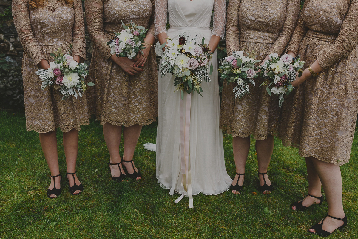 Bride Lucy wore the 'Peony' gown by Naomi Neoh for her romantic and elegant gin inspired wedding in the Lake District. Photography by Lottie Elizabeth.