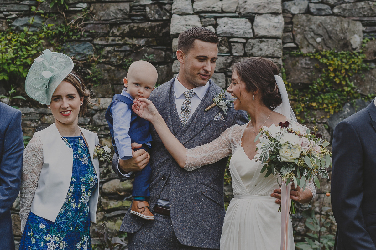 Bride Lucy wore the 'Peony' gown by Naomi Neoh for her romantic and elegant gin inspired wedding in the Lake District. Photography by Lottie Elizabeth.