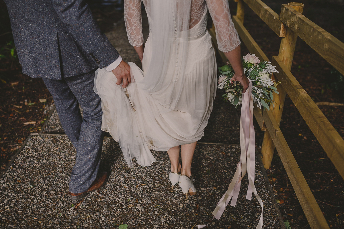 Bride Lucy wore the 'Peony' gown by Naomi Neoh for her romantic and elegant gin inspired wedding in the Lake District. Photography by Lottie Elizabeth.