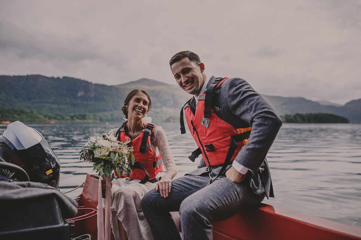 Bride Lucy wore the 'Peony' gown by Naomi Neoh for her romantic and elegant gin inspired wedding in the Lake District. Photography by Lottie Elizabeth.