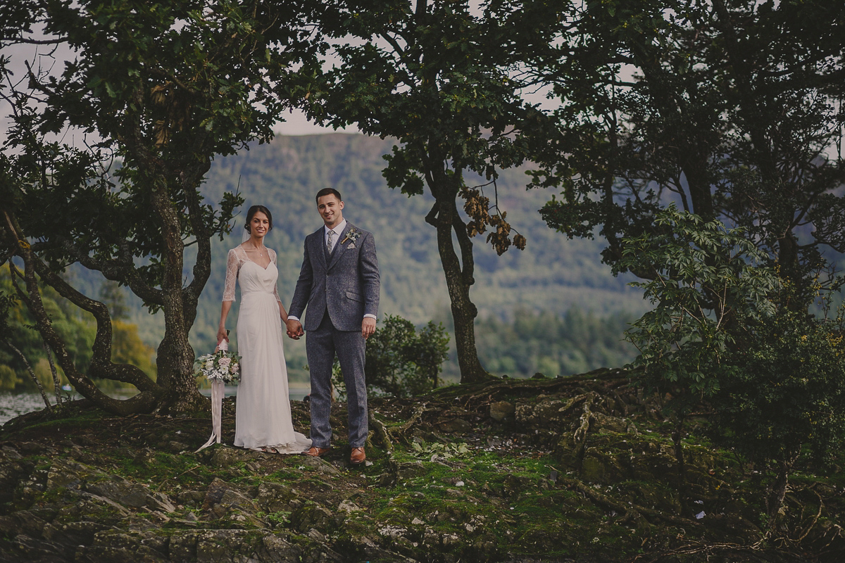 Bride Lucy wore the 'Peony' gown by Naomi Neoh for her romantic and elegant gin inspired wedding in the Lake District. Photography by Lottie Elizabeth.