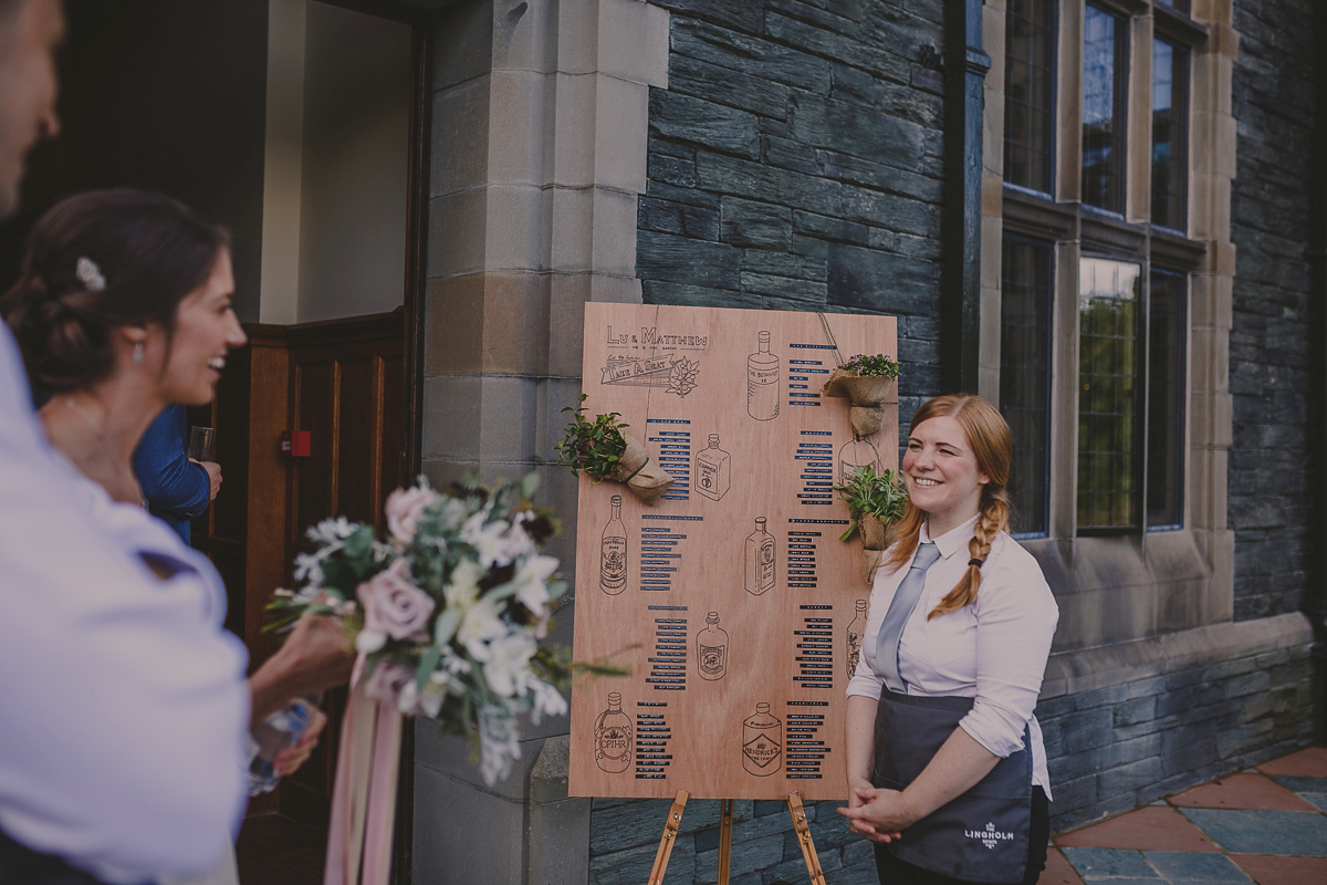 Bride Lucy wore the 'Peony' gown by Naomi Neoh for her romantic and elegant gin inspired wedding in the Lake District. Photography by Lottie Elizabeth.