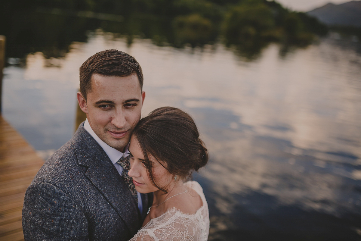 Bride Lucy wore the 'Peony' gown by Naomi Neoh for her romantic and elegant gin inspired wedding in the Lake District. Photography by Lottie Elizabeth.