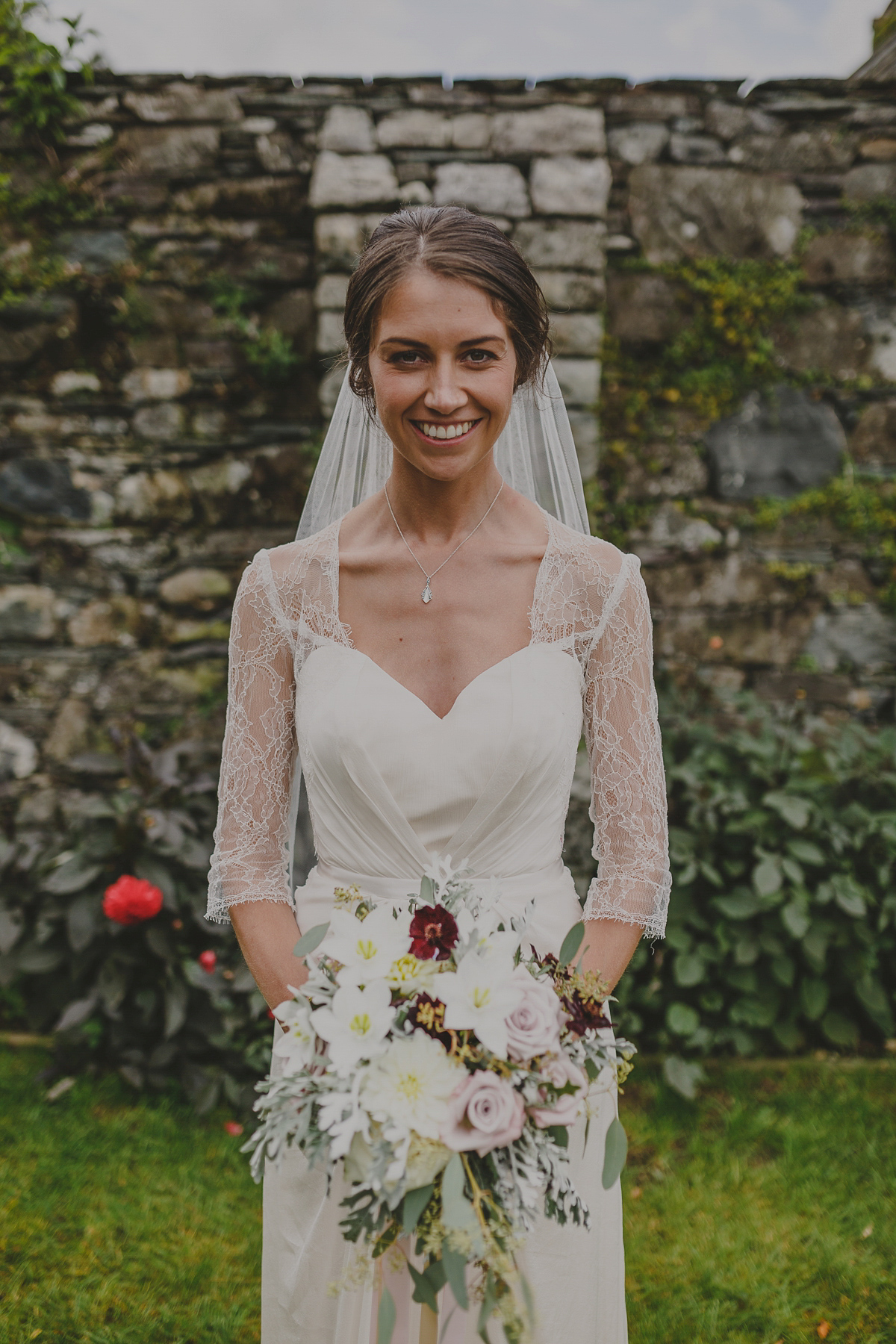 Bride Lucy wore the 'Peony' gown by Naomi Neoh for her romantic and elegant gin inspired wedding in the Lake District. Photography by Lottie Elizabeth.