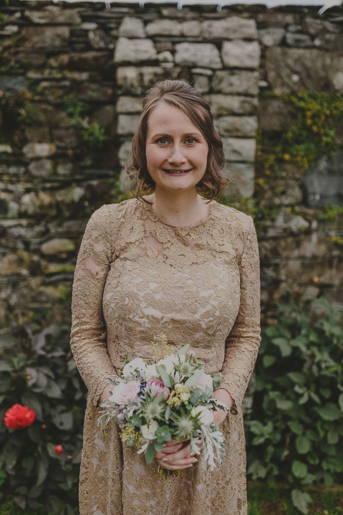 Bride Lucy wore the 'Peony' gown by Naomi Neoh for her romantic and elegant gin inspired wedding in the Lake District. Photography by Lottie Elizabeth.