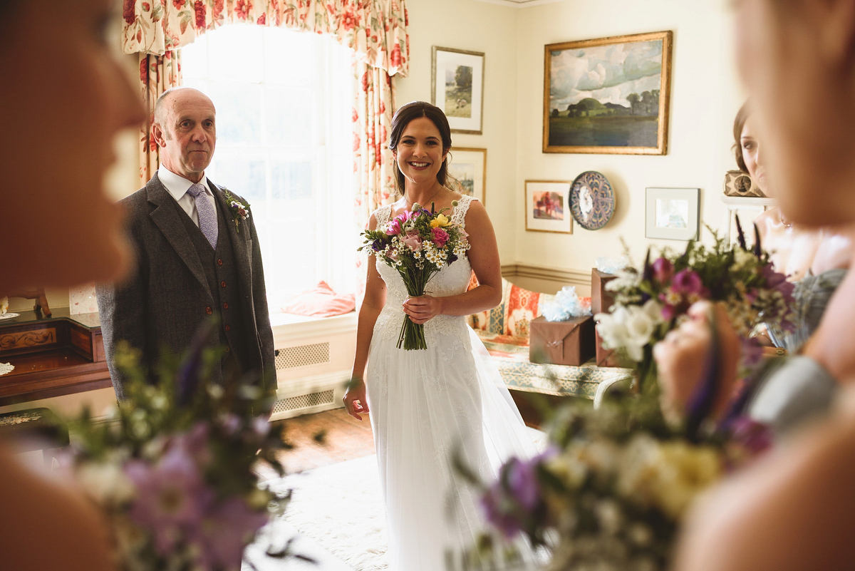 Bride Sarah wore a Lusan Mandongus gown and a dried flower headpiece for her relaxed and elegant wedding at Walcot Hall. Photography by Jackson & Co.