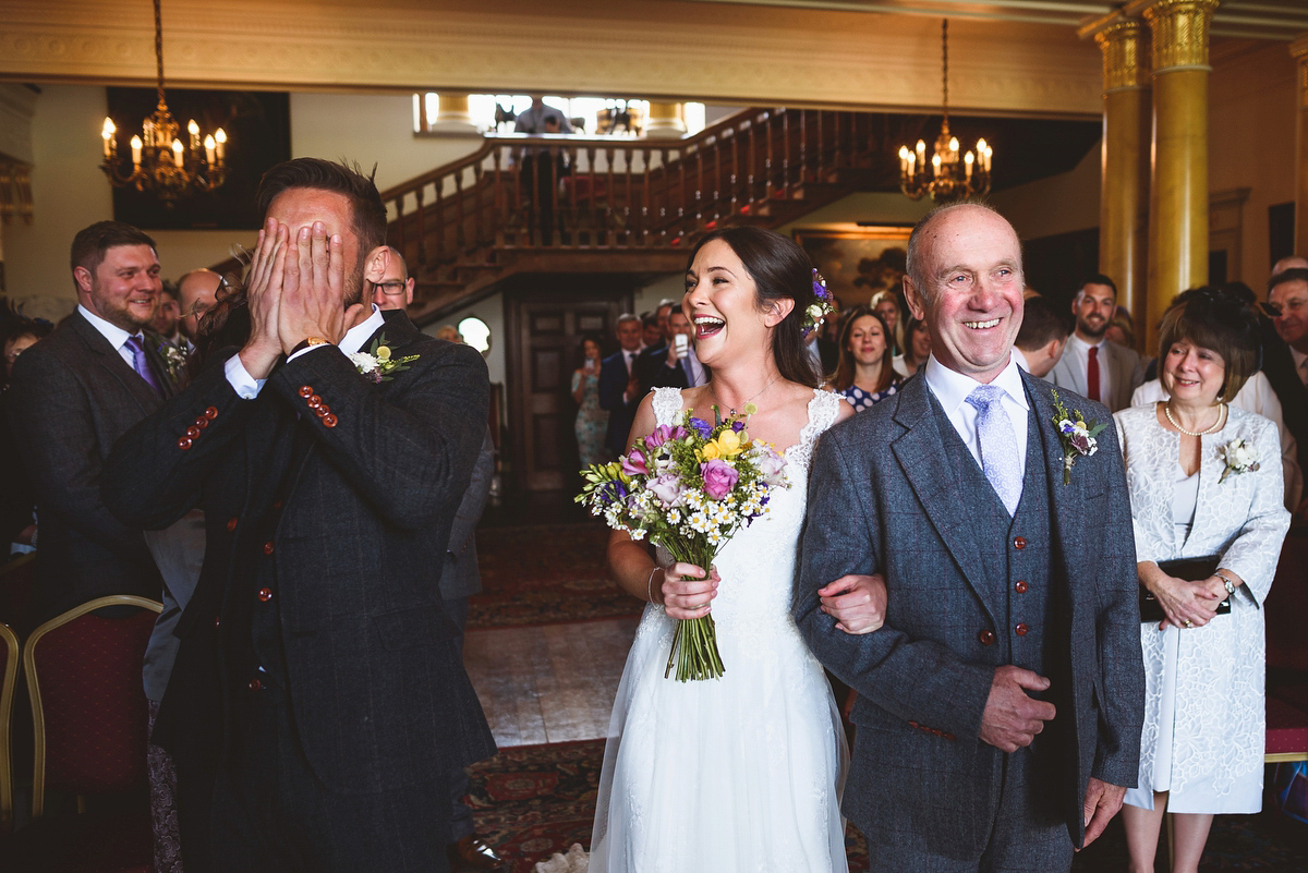 Bride Sarah wore a Lusan Mandongus gown and a dried flower headpiece for her relaxed and elegant wedding at Walcot Hall. Photography by Jackson & Co.