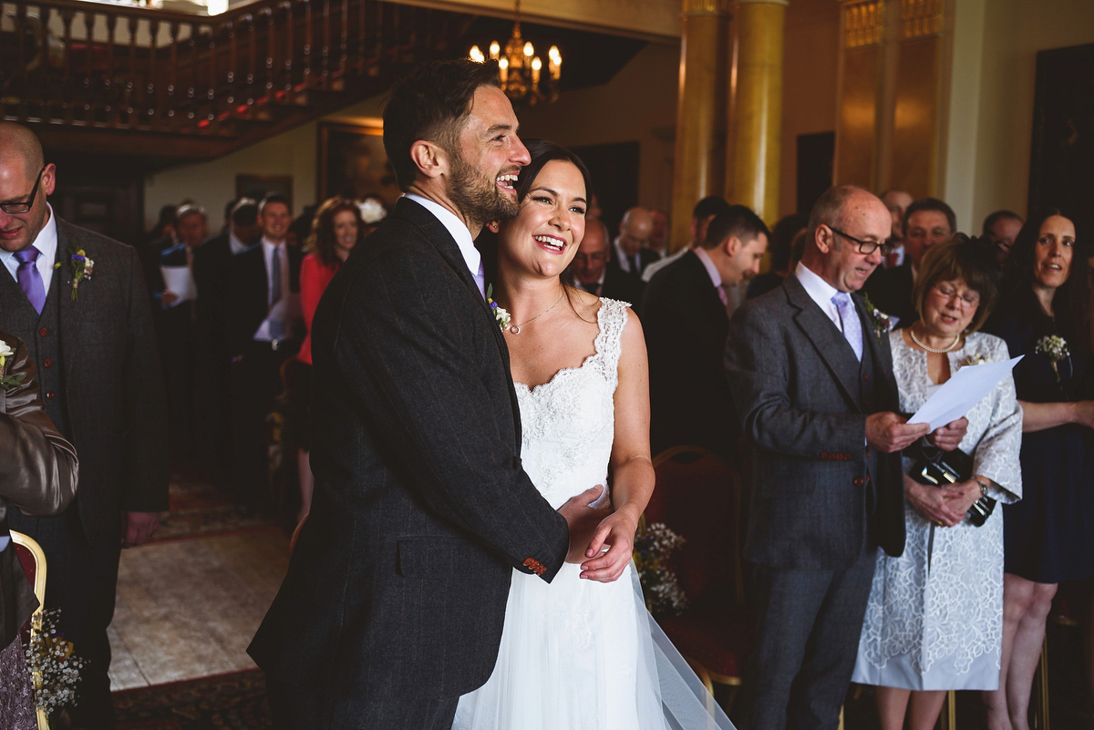 Bride Sarah wore a Lusan Mandongus gown and a dried flower headpiece for her relaxed and elegant wedding at Walcot Hall. Photography by Jackson & Co.