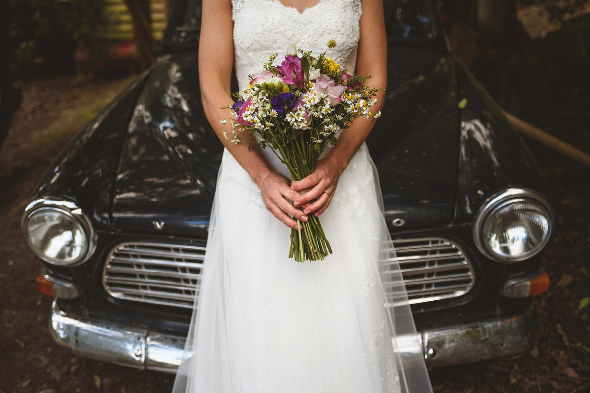 Bride Sarah wore a Lusan Mandongus gown and a dried flower headpiece for her relaxed and elegant wedding at Walcot Hall. Photography by Jackson & Co.