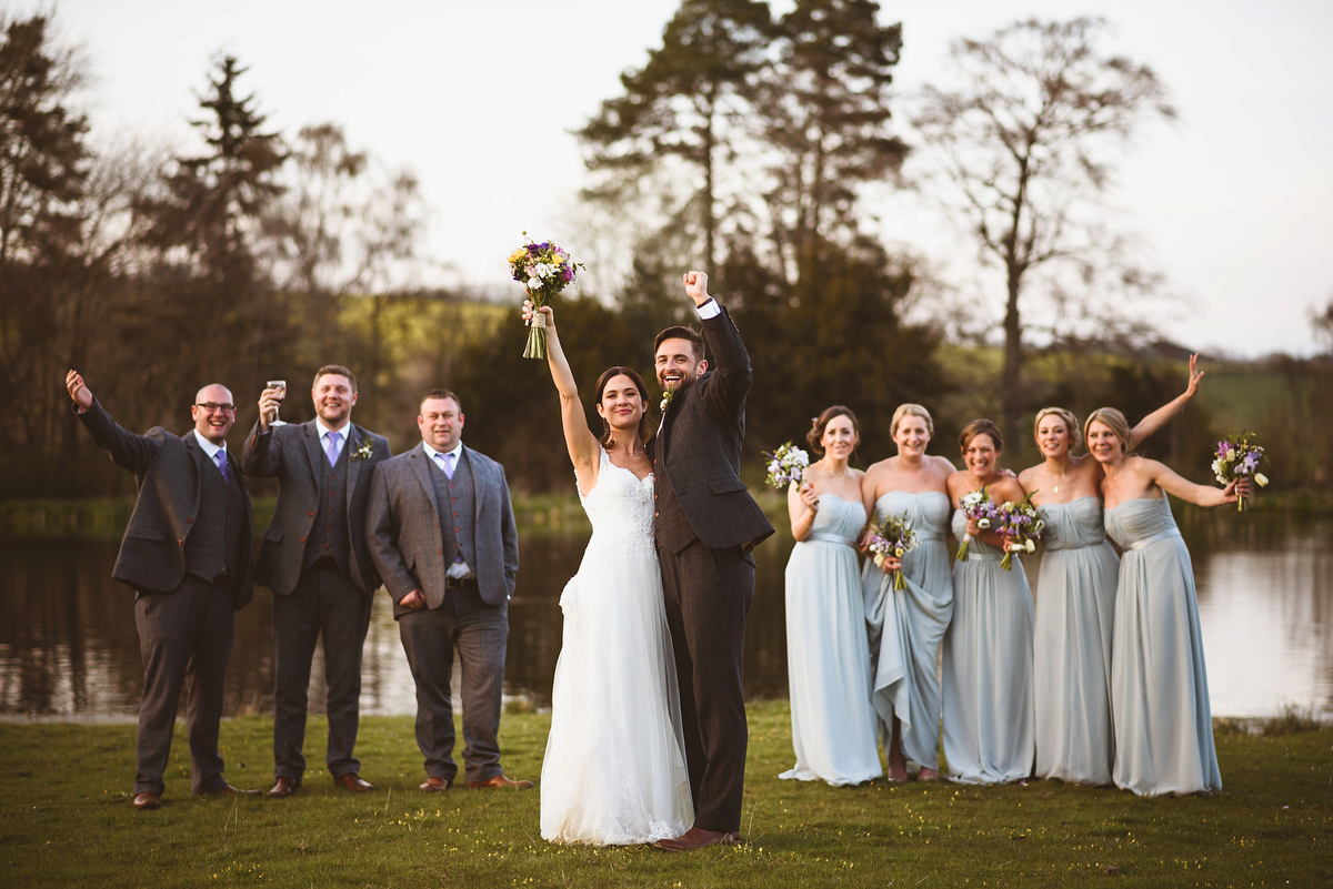 Bride Sarah wore a Lusan Mandongus gown and a dried flower headpiece for her relaxed and elegant wedding at Walcot Hall. Photography by Jackson & Co.