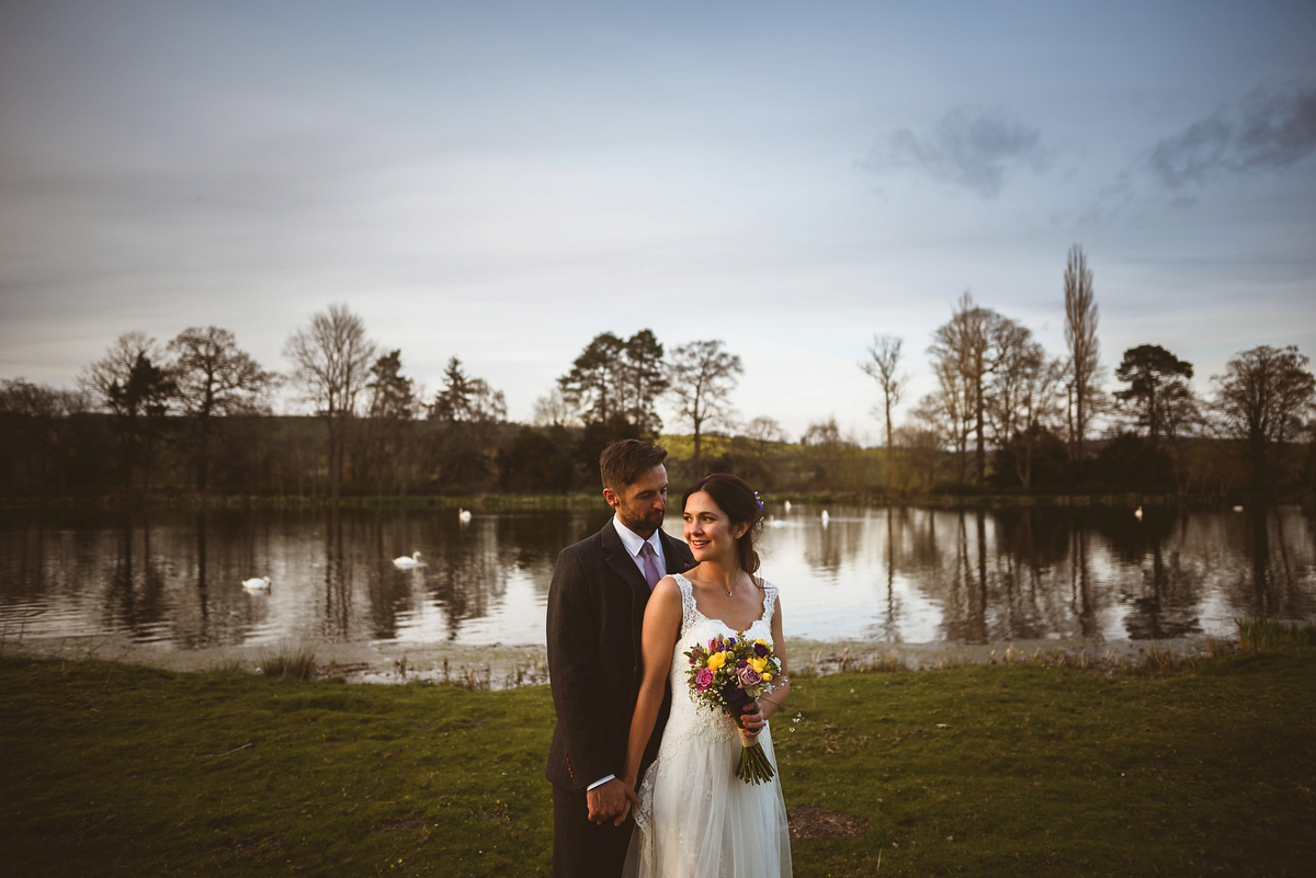 Bride Sarah wore a Lusan Mandongus gown and a dried flower headpiece for her relaxed and elegant wedding at Walcot Hall. Photography by Jackson & Co.