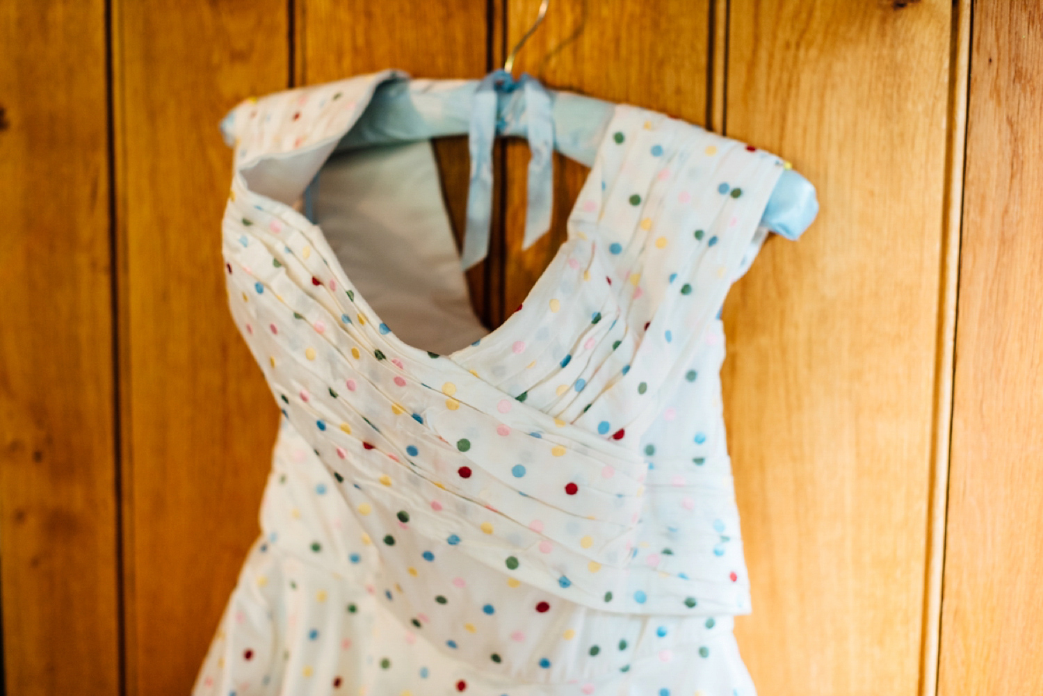 Bride Frankie wore a 1950's inspired, colourful polka dot dress by 'Oh My Honey' for her geek-chic and reto inspired wedding. Photography by Anna Pumer.