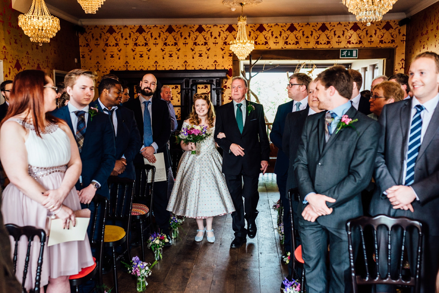 Bride Frankie wore a 1950's inspired, colourful polka dot dress by 'Oh My Honey' for her geek-chic and reto inspired wedding. Photography by Anna Pumer.