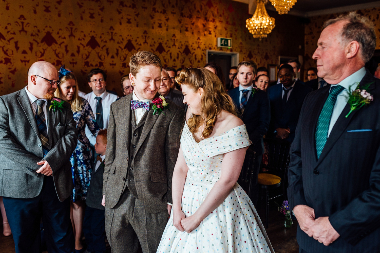 Bride Frankie wore a 1950's inspired, colourful polka dot dress by 'Oh My Honey' for her geek-chic and reto inspired wedding. Photography by Anna Pumer.