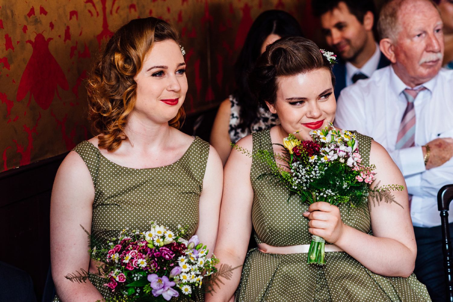 Bride Frankie wore a 1950's inspired, colourful polka dot dress by 'Oh My Honey' for her geek-chic and reto inspired wedding. Photography by Anna Pumer.