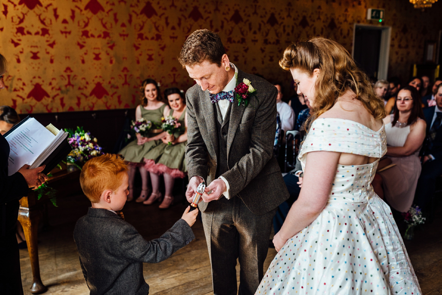 Bride Frankie wore a 1950's inspired, colourful polka dot dress by 'Oh My Honey' for her geek-chic and reto inspired wedding. Photography by Anna Pumer.