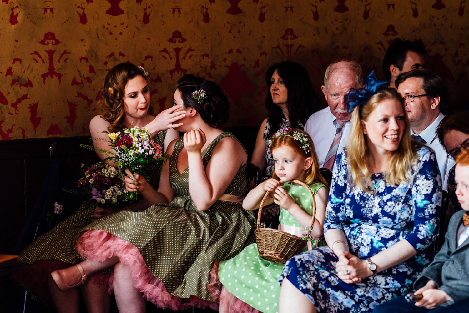 Bride Frankie wore a 1950's inspired, colourful polka dot dress by 'Oh My Honey' for her geek-chic and reto inspired wedding. Photography by Anna Pumer.