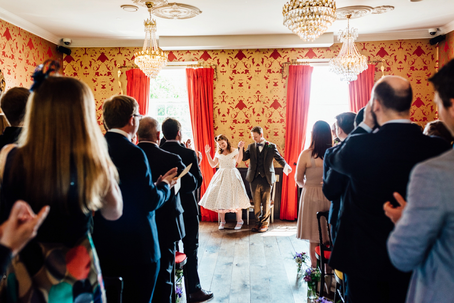 Bride Frankie wore a 1950's inspired, colourful polka dot dress by 'Oh My Honey' for her geek-chic and reto inspired wedding. Photography by Anna Pumer.