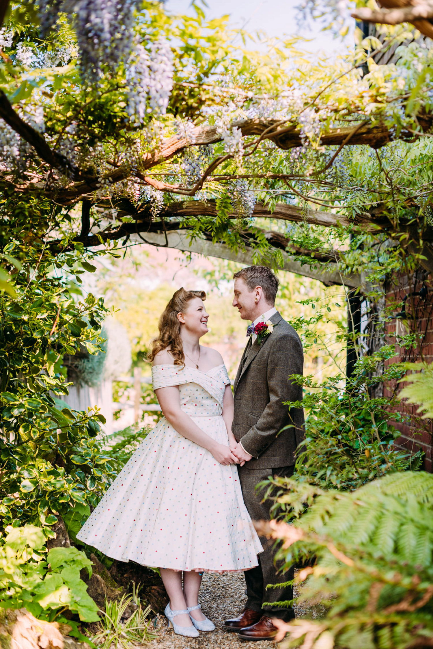 Bride Frankie wore a 1950's inspired, colourful polka dot dress by 'Oh My Honey' for her geek-chic and reto inspired wedding. Photography by Anna Pumer.