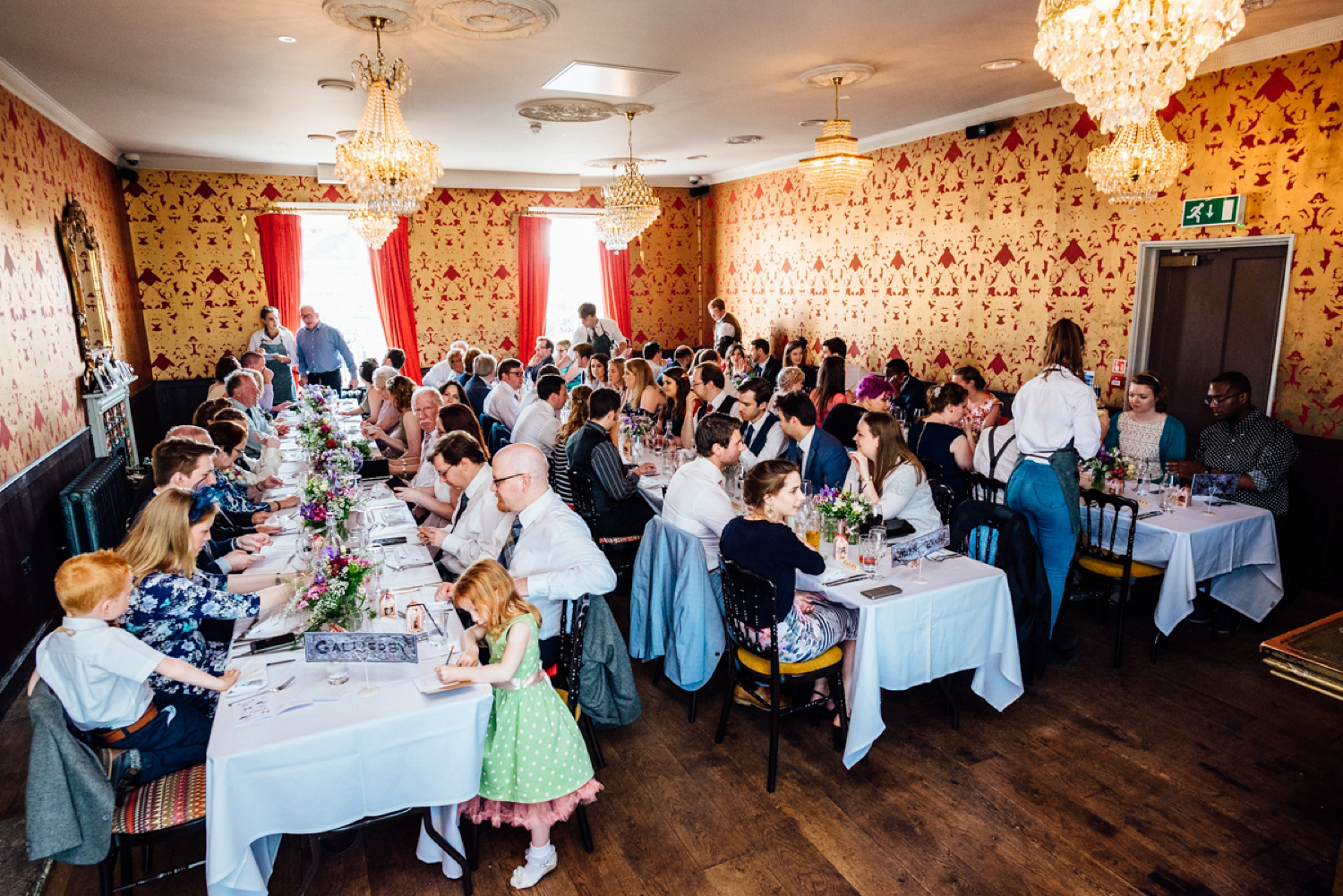 Bride Frankie wore a 1950's inspired, colourful polka dot dress by 'Oh My Honey' for her geek-chic and reto inspired wedding. Photography by Anna Pumer.