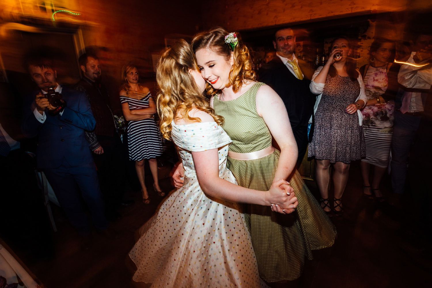 Bride Frankie wore a 1950's inspired, colourful polka dot dress by 'Oh My Honey' for her geek-chic and reto inspired wedding. Photography by Anna Pumer.