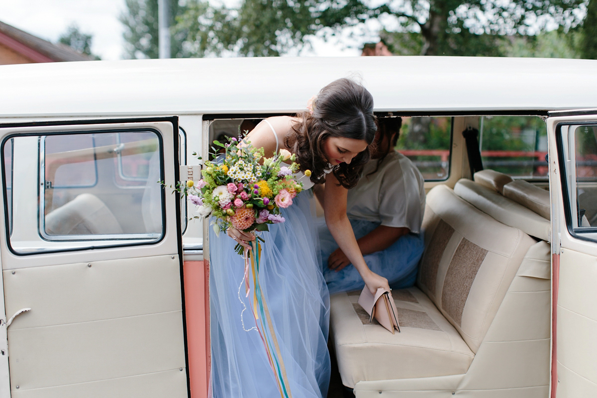 Bride Emma-Jane wore a pale pink skirt and lace top for her Scottish chapel wedding. Her maids wore pale blue and floral crowns. Photography by Caro Weiss.