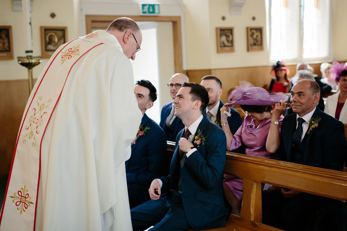 Bride Emma-Jane wore a pale pink skirt and lace top for her Scottish chapel wedding. Her maids wore pale blue and floral crowns. Photography by Caro Weiss.