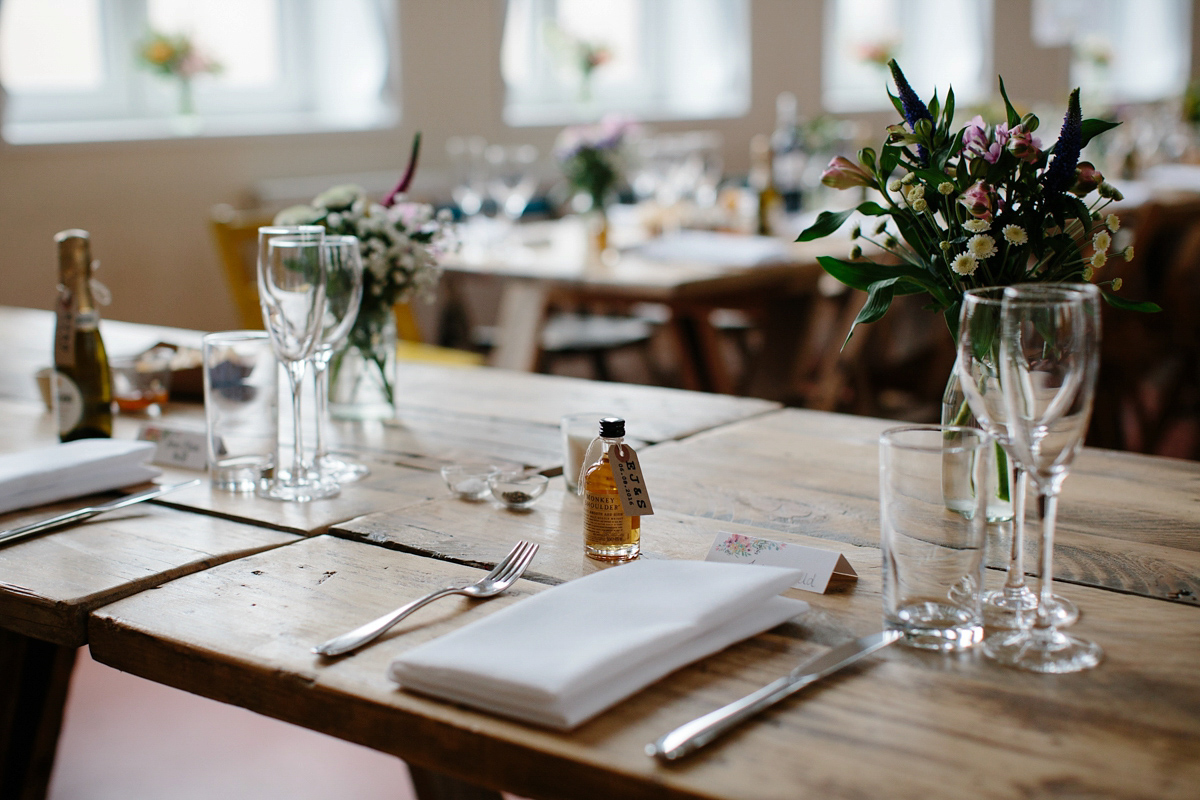 Bride Emma-Jane wore a pale pink skirt and lace top for her Scottish chapel wedding. Her maids wore pale blue and floral crowns. Photography by Caro Weiss.