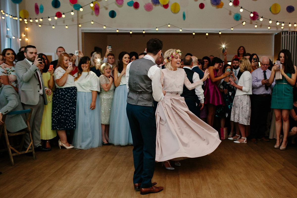 Bride Emma-Jane wore a pale pink skirt and lace top for her Scottish chapel wedding. Her maids wore pale blue and floral crowns. Photography by Caro Weiss.