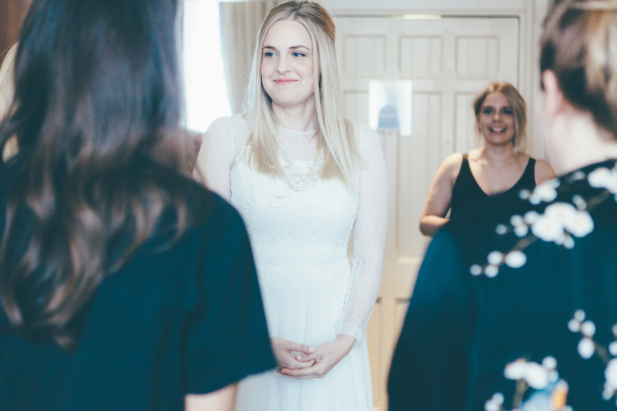 Ash wore a Jesus Peiro gown and winged shoes by Sophia Webster for her stripped back and fuss free wedding in London. Captured by September Pictures.