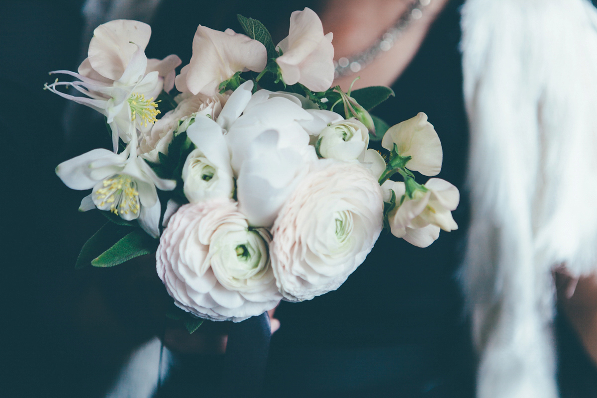 Ash wore a Jesus Peiro gown and winged shoes by Sophia Webster for her stripped back and fuss free wedding in London. Captured by September Pictures.