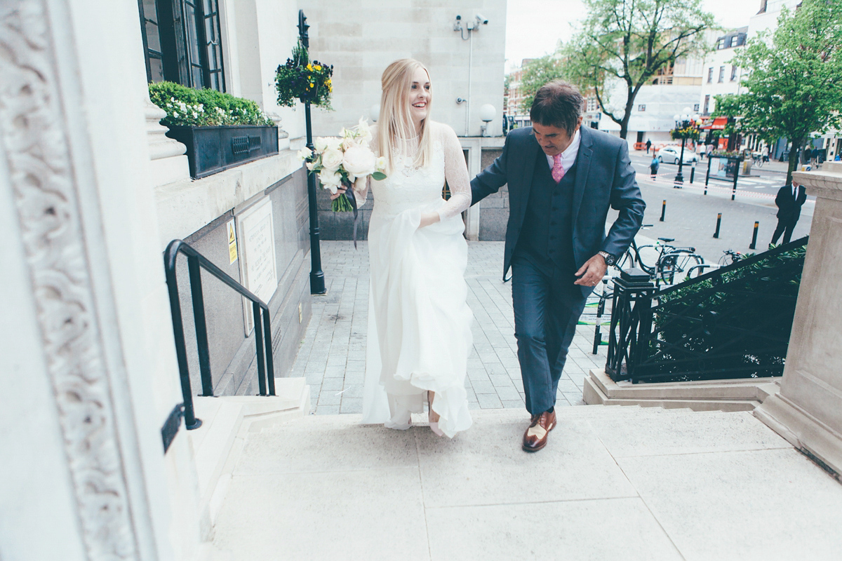 Ash wore a Jesus Peiro gown and winged shoes by Sophia Webster for her stripped back and fuss free wedding in London. Captured by September Pictures.