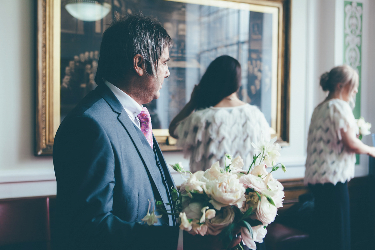 Ash wore a Jesus Peiro gown and winged shoes by Sophia Webster for her stripped back and fuss free wedding in London. Captured by September Pictures.