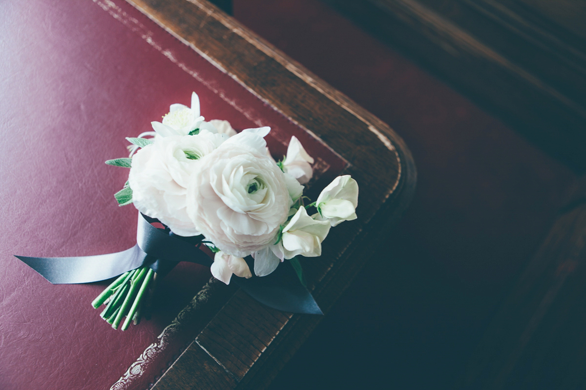 Ash wore a Jesus Peiro gown and winged shoes by Sophia Webster for her stripped back and fuss free wedding in London. Captured by September Pictures.