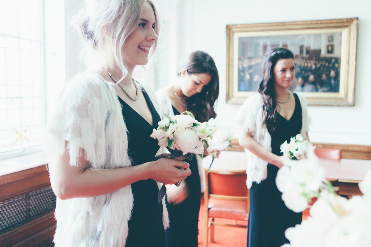 Ash wore a Jesus Peiro gown and winged shoes by Sophia Webster for her stripped back and fuss free wedding in London. Captured by September Pictures.