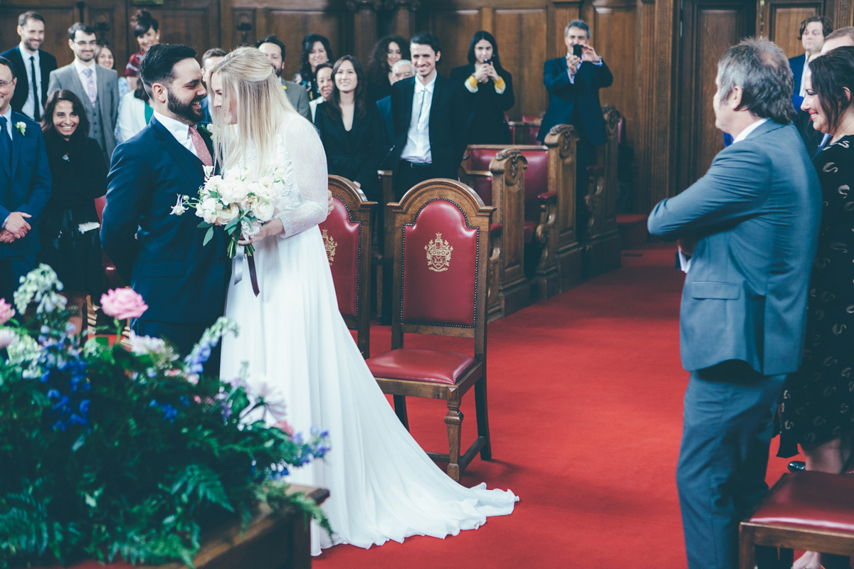 Ash wore a Jesus Peiro gown and winged shoes by Sophia Webster for her stripped back and fuss free wedding in London. Captured by September Pictures.
