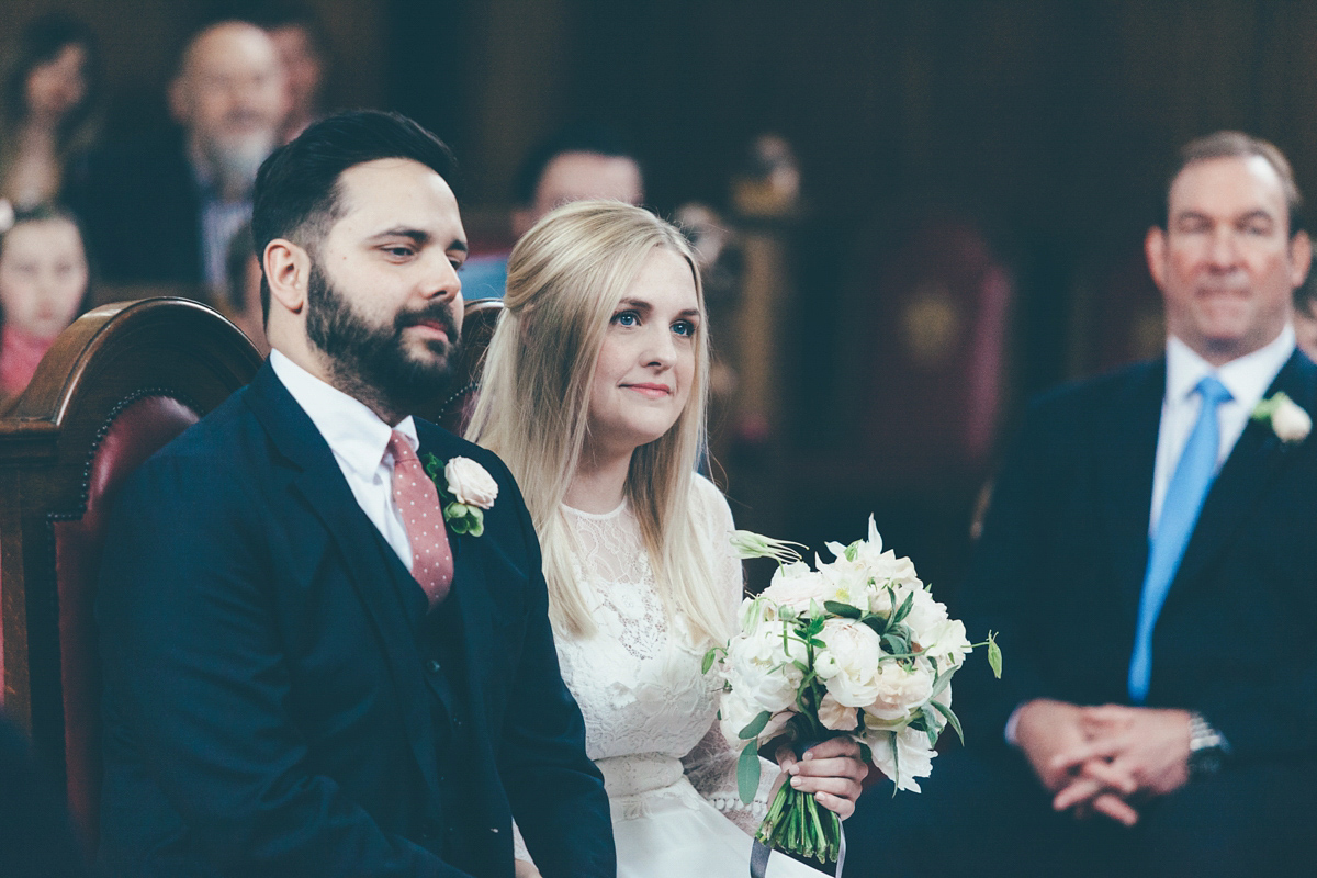 Ash wore a Jesus Peiro gown and winged shoes by Sophia Webster for her stripped back and fuss free wedding in London. Captured by September Pictures.