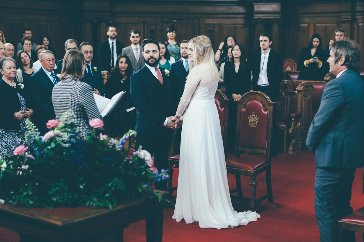 Ash wore a Jesus Peiro gown and winged shoes by Sophia Webster for her stripped back and fuss free wedding in London. Captured by September Pictures.